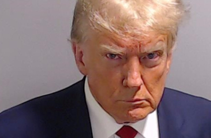  Former U.S. President Donald Trump is shown in a police booking mugshot released by the Fulton County Sheriff's Office, after a Grand Jury brought back indictments against him and 18 of his allies in their attempt to overturn the state's 2020 election results in Atlanta, Georgia, U.S., August 24, 2 (photo credit: Fulton County Sheriff's Office/Handout)