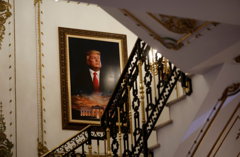  A portrait of former US President Donald Trump over the White House is seen on a stairway of his Mar-a-Lago estate. (photo credit: REUTERS/JONATHAN ERNST)