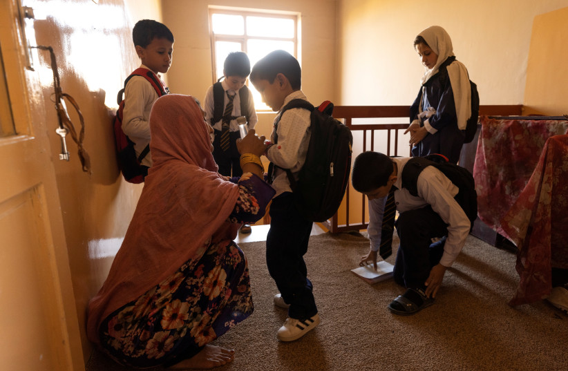  Children getting ready for school at an orphanage in Kabul, Afghanistan, October 12, 2021 (photo credit: REUTERS/JORGE SILVA)