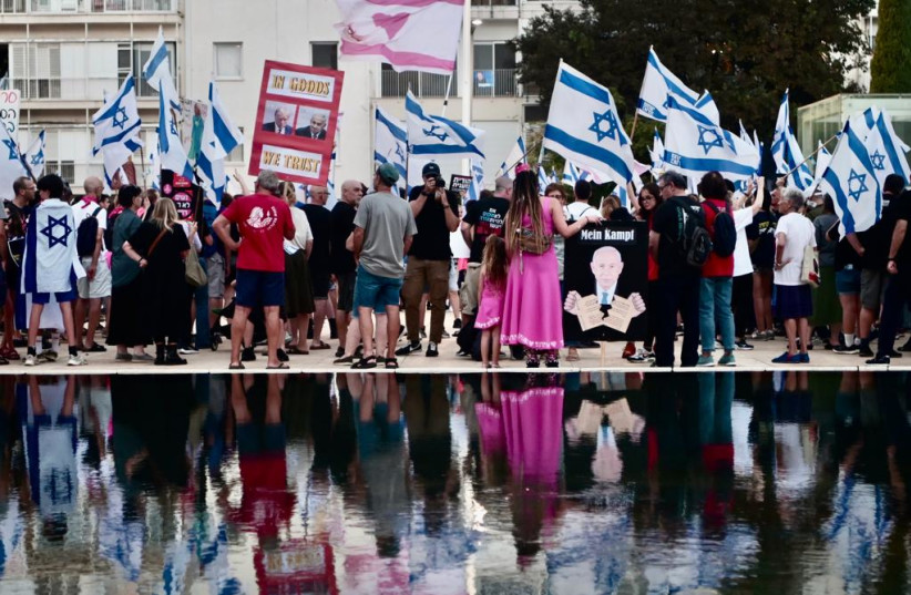 Israeli judicial reform protesters are seen at Tel Aviv's Habima Theater on August 26, 2023 (photo credit: AVSHALOM SASSONI/MAARIV)