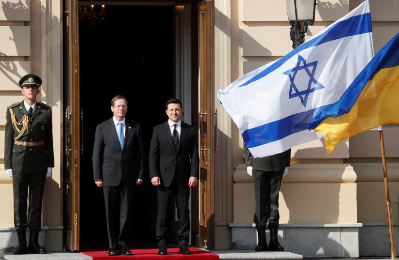  Ukrainian President Volodymyr Zelensky and Israeli President Isaac Herzog attend a welcoming ceremony as they meet in Kyiv, Ukraine October 5, 2021. (photo credit: GLEB GARANICH/REUTERS)