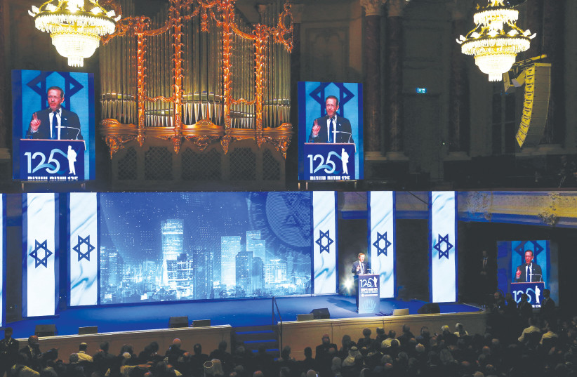  PRESIDENT ISAAC HERZOG addresses a gala event on August 29, 2022, on the occasion of the 125th anniversary of the First Zionist Congress, at the original venue, the Stadtcasino Basel, in Basel, Switzerland. (photo credit: Arnd Wiegmann/Reuters)