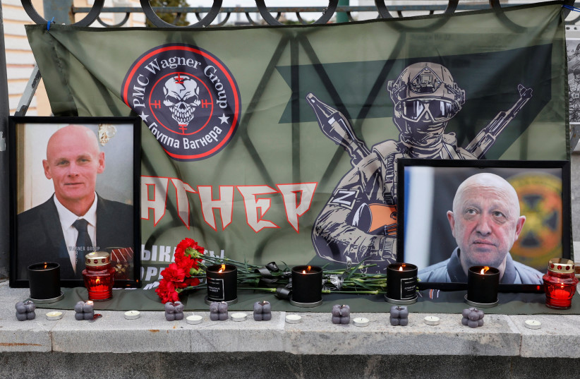  A view shows portraits of Russian mercenary chief Yevgeny Prigozhin and Wagner group commander Dmitry Utkin at a makeshift memorial in Moscow, Russia August 24, 2023. (photo credit: REUTERS/STRINGER)