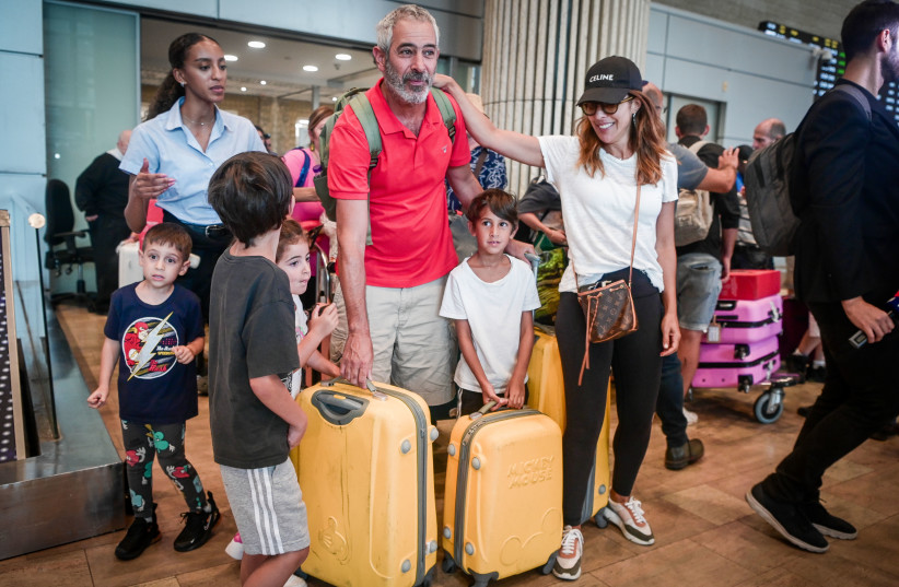  Israeli passengers who were on the flight from Seychelles and made an emergency landing in Saudi Arabia, seen after their arrival at the Ben Gurion International Airport near Tel Aviv, August 29, 2023.  (photo credit: AVSHALOM SASSONI/FLASH90)