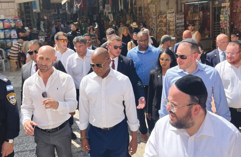  THE WRITER, on the right wearing a light blue shirt, walks alongside New York City Mayor Eric Adams in Jerusalem’s Old City, last week.  (photo credit: Courtesy David Greenfield)