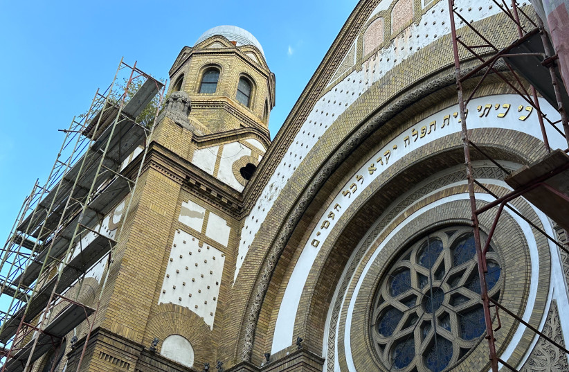  Scaffolding surrounds the facade of the Novi Sad Synagogue as it undergoes a major renovation.  (photo credit: LARRY LUXNER/JTA)