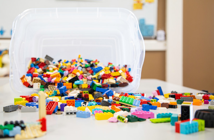  Lego blocks in a plastic container (illustrative) (photo credit: PEXELS)