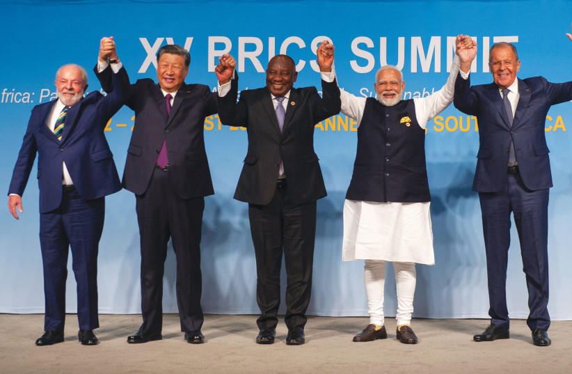  BRICS SUMMIT: (From L) Brazil’s President Luiz Inacio Lula da Silva; China’s President Xi Jinping; South African President Cyril Ramaphosa; Indian Prime Minister Narendra Modi; and Russia’s Foreign Minister Sergei Lavrov pose in Johannesburg, Aug. 23.  (photo credit: Alet Pretorius/Pool/AFP via Getty Images)