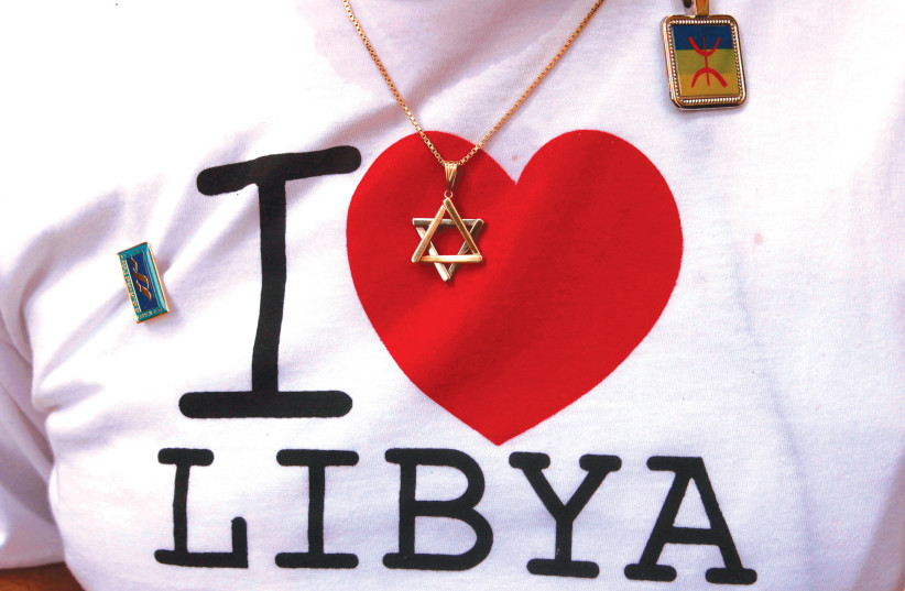  A STAR of David rests against a T-shirt worn by a Libyan-born Jew during a visit to Tripoli after the fall of Muammar Gaddafi in 2011. (photo credit: SUHAIB SALEM/REUTERS)