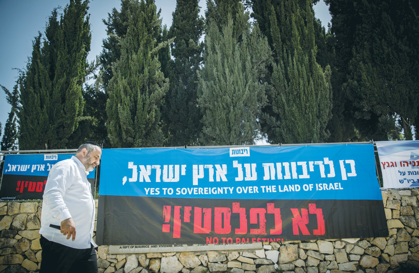  SIGNS WITH slogans in support of imposing Israeli sovereignty over Judea, Samaria, and the Jordan Valley are posted near the Prime Minister’s Office in Jerusalem, in 2020.  (photo credit: YONATAN SINDEL/FLASH90)