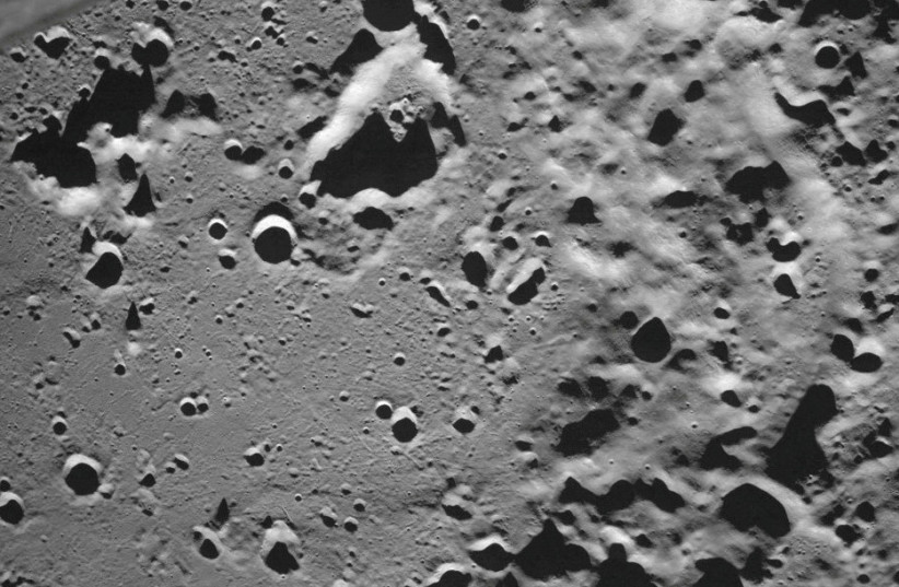  A picture taken from the camera of the lunar landing spacecraft Luna-25 shows the Zeeman crater located on the far side of the moon (photo credit: REUTERS)
