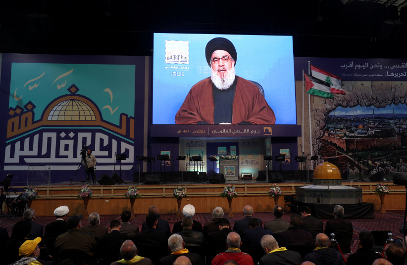  Lebanon's Hezbollah leader Sayyed Hassan Nasrallah addresses his supporters through a screen during a rally marking al-Quds Day, (Jerusalem Day) in Beirut's southern suburbs, Lebanon April 14, 2023 (photo credit: REUTERS/AZIZ TAHER)