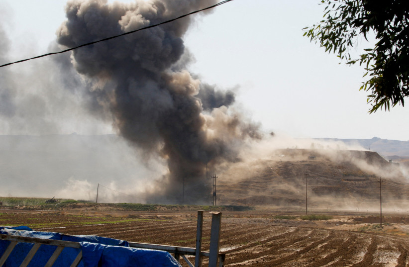  Smoke rises from the Iraqi Kurdistan headquarters of the Kurdistan Freedom Party (PAK), after Iran's Revolutionary Guards' strike on the outskirts of Kirkuk, Iraq September 28, 2022.  (photo credit: AKO RASHEED/REUTERS)