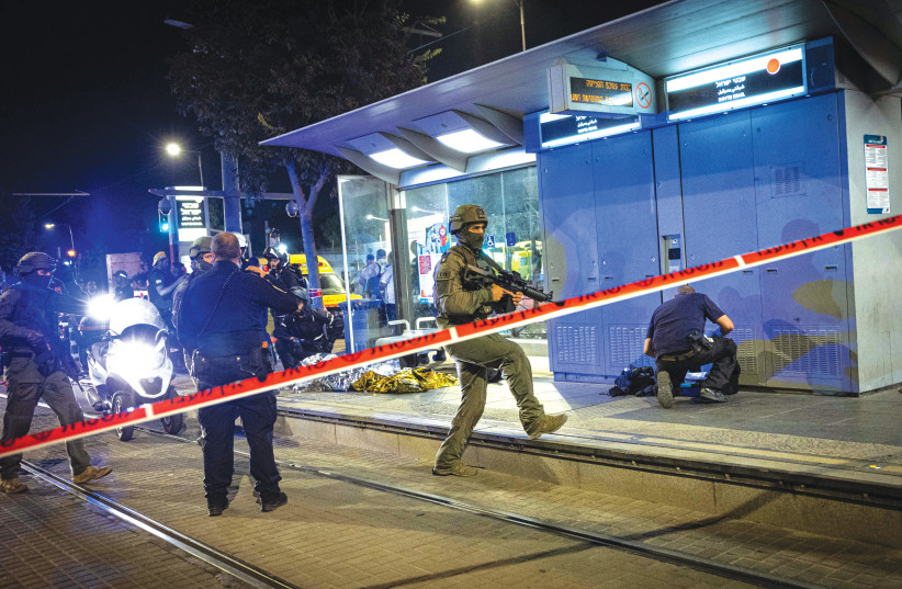  SECURITY FORCES are on the scene of a Palestinian terror stabbing attack in which an Israeli man was wounded at a light rail station in Jerusalem last week. (photo credit: YONATAN SINDEL/FLASH90)