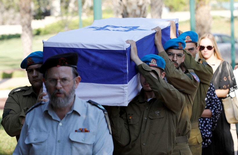  Soldiers carry a coffin of Maksym Molchanov, an Israeli soldier who moved to Israel from Ukraine and was killed in a ramming attack adjacent to the Maccabim Checkpoint, at his funeral in Tel Aviv, Israel September 5, 2023 (photo credit: REUTERS)