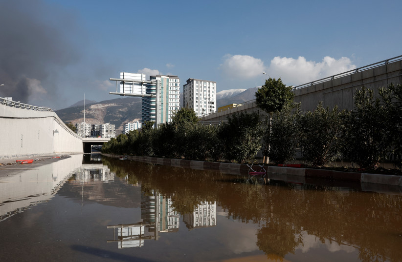  Flooded roads and buildings are seen on a coastal road, due to rising sea levels, following a deadly earthquake in Iskenderun, Turkey, February 9, 2023. (photo credit: BENOIT TESSIER/REUTERS)