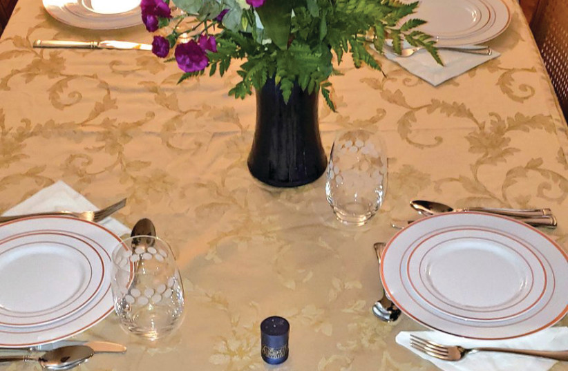  A FESTIVELY-SET table: If you are having someone over on the holidays who is childless, treat them like everyone else. Don’t offer extra advice, tips, questions, or mercy; just a friendly welcome, says the writer.  (photo credit: Rabbi Elchanan Poupko)