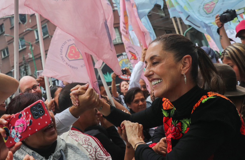  Former Mexico City Mayor Claudia Sheinbaum greets supporters during an event, pursuing to be the ruling MORENA party's candidate for the 2024 presidential election, in Mexico City, Mexico, August 26, 2023 (photo credit: REUTERS/Raquel Cunha)