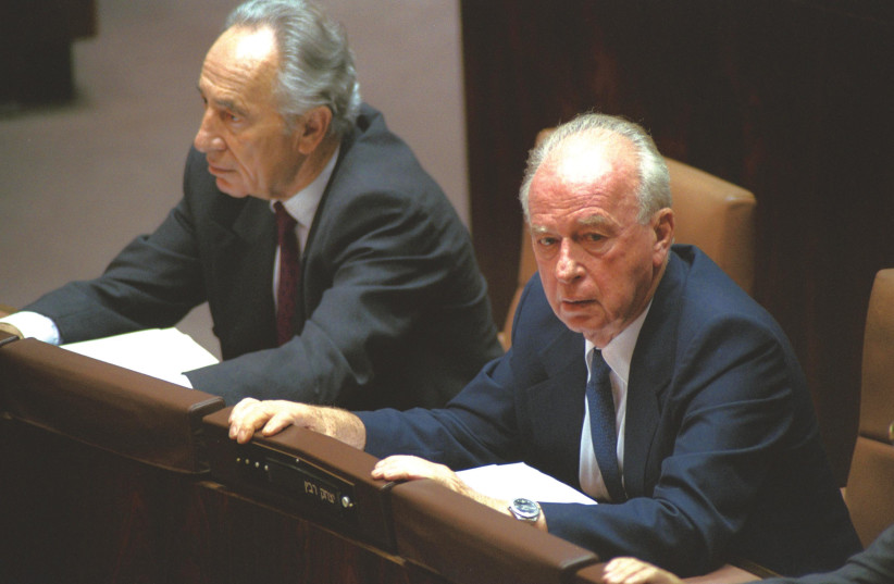  THEN-FOREIGN minister Shimon Peres and prime minister Yitzhak Rabin attend the Knesset debate on the Oslo I agreement on September 21, 1993. (photo credit: Avi Ohayon/GPO)