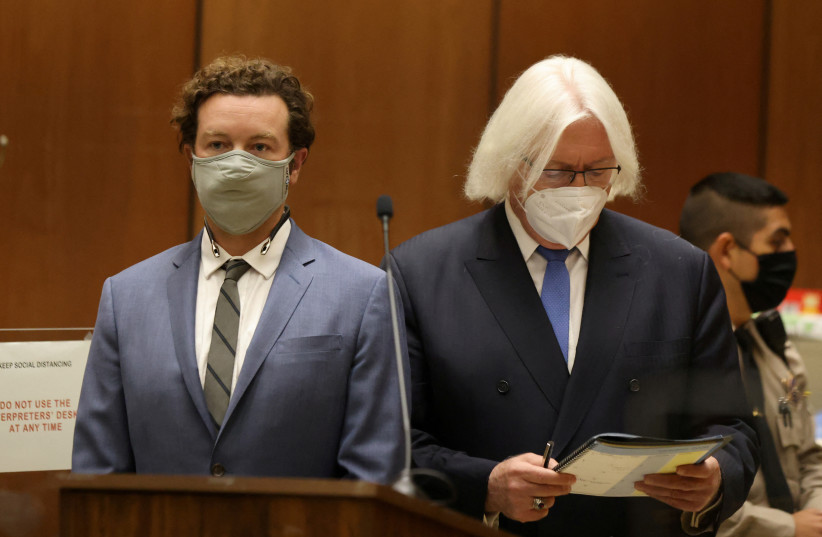  Actor Danny Masterson stands with his lawyer Thomas Mesereau as he is arraigned on three rape charges in separate incidents between 2001 and 2003, at Los Angeles Superior Court, Los Angeles, California, U.S., September 18, 2020. (photo credit: REUTERS/LUCY NICHOLSON/FILE PHOTO)