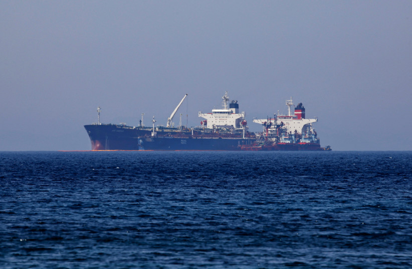  The Liberian-flagged oil tanker Ice Energy transfers crude oil from the Iranian-flagged oil tanker Lana (former Pegas), off the shore of Karystos, on the Island of Evia, Greece, May 26, 2022. (photo credit: REUTERS/COSTAS BALTAS)