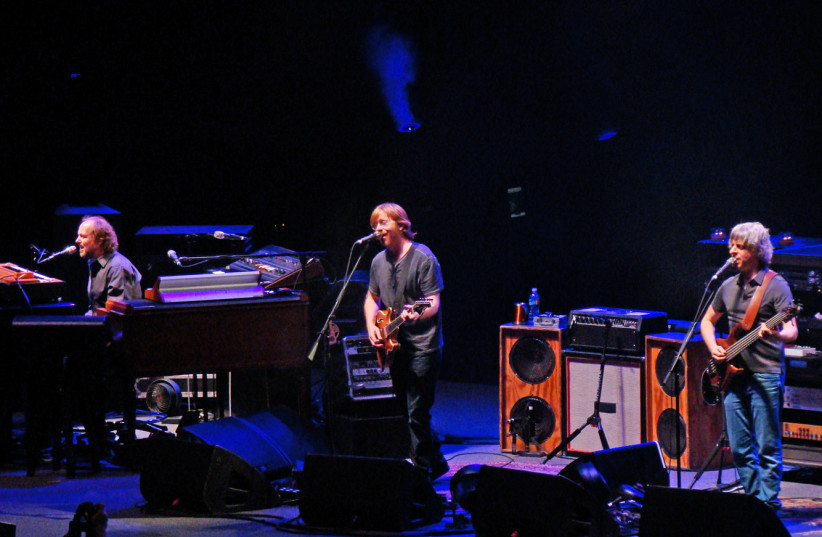  Phish on December 30, 2009 at the American Airlines Arena in Miami Florida. Left to right: Page McConnell, Trey Anastasio and Mike Gordon. (photo credit: Wikimedia Commons)