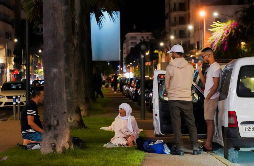  People gather on a street in Casablanca, following a powerful earthquake in Morocco, September 9, 2023.  (photo credit: REUTERS/Abdelhak Balhaki)