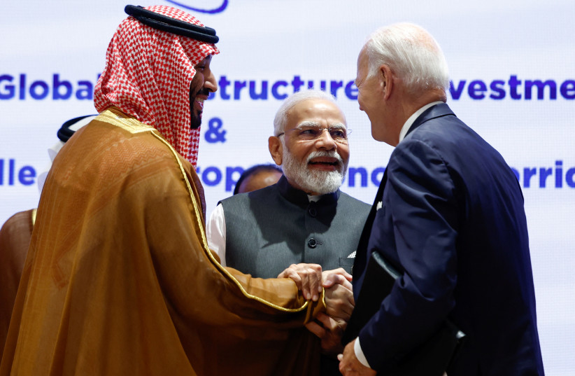  Saudi Arabian Crown Prince Mohammed bin Salman Al Saud and U.S. President Joe Biden shake hands next to Indian Prime Minister Narendra Modi on the day of the G20 summit in New Delhi, India, September 9, 2023.  (photo credit: REUTERS/EVELYN HOCKSTEIN)