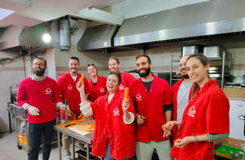  Monday.com employees visited Meir Panim as a part of a team-building retreat (photo credit: MEIR PANIM)