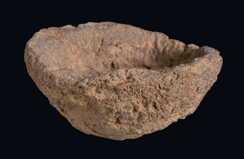  Clay rattle fragment. (photo credit: CLARA AMIT/ISRAEL ANTIQUITIES AUTHORITY)