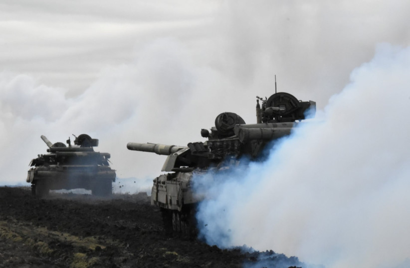 Tanks of the Ukrainian Armed Forces are seen during drills at an unknown location near the border of Russian-annexed Crimea, Ukraine, April 14, 2021. (photo credit: Press Service General Staff of the Armed Forces of Ukraine/Handout via REUTERS)