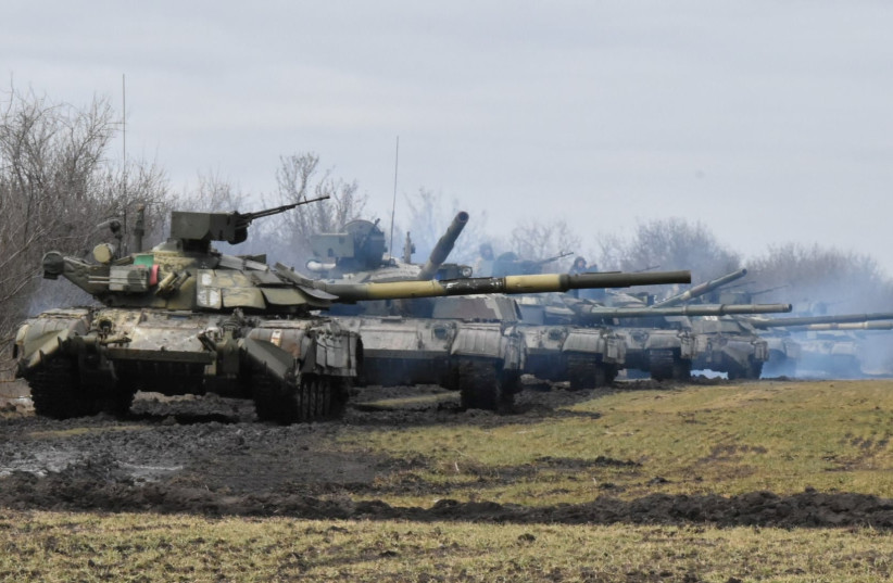   Tanks of the Ukrainian Armed Forces are seen during drills at an unknown location near the border of Russian-annexed Crimea, Ukraine, April 14, 2021. (photo credit: Press Service General Staff of the Armed Forces of Ukraine/Handout via REUTERS)