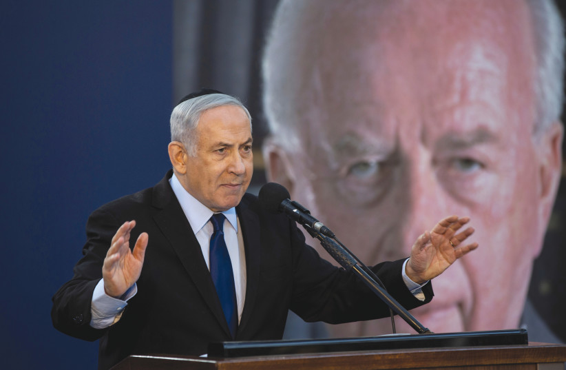  PRIME MINISTER Benjamin Netanyahu addresses a memorial ceremony for Yitzhak Rabin, in 2019. Similar to Netanyahu, Rabin didn’t support the establishment of a Palestinian state, rather of a ‘minus-state.’ (photo credit: Heidi Levine/Reuters)