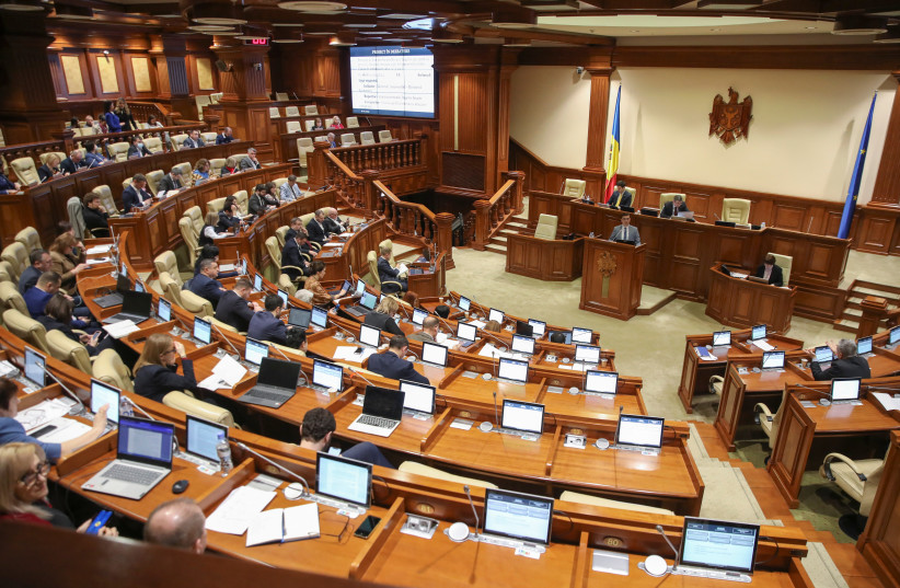  Members of parliament hold a session in Chisinau, Moldova, February 16, 2023.  (photo credit: VLADISLAV CULIOMZA / REUTERS)