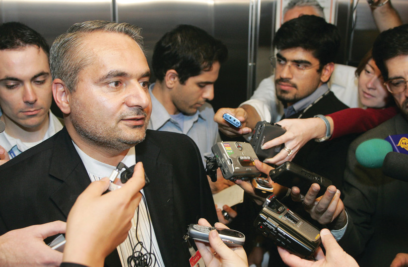  THEN-IRANIAN chief delegate Hussein Mousavian briefs the media after an International Atomic Energy Agency Board of Governors meeting in Vienna, in 2004.  (photo credit: HERWIG PRAMMER/REUTERS)