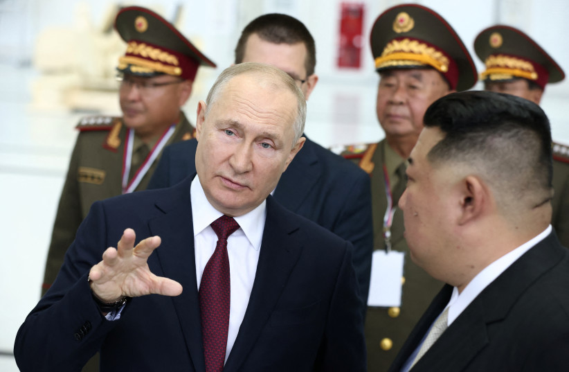  Russia's President Vladimir Putin talks to North Korea's leader Kim Jong Un as they visit the Vostochny Сosmodrome in the far eastern Amur region, Russia, September 13, 2023 (photo credit: SPUTNIK/ARTEM GEODAKYAN/POOL VIA REUTERS)