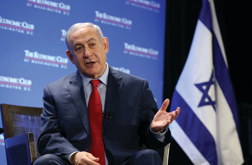  PRIME MINISTER Benjamin Netanyahu is interviewed at the Economic Club of Washington, in 2018. His recent presence in the US media was notable for a willingness to discuss in America what he was reluctant to address in Israeli media, says the writer.  (photo credit: REUTERS)