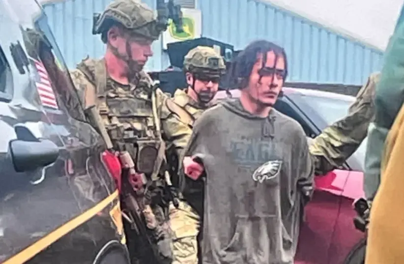 The detained suspect was found with blood on his face. (photo credit: PENNSYLVANIA STATE POLICE)