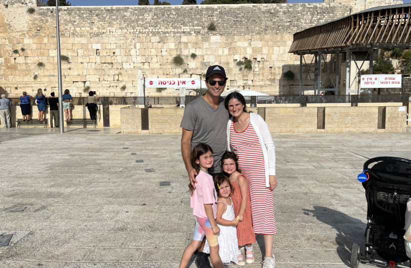  LOUISE SUTTON SUEDE poses with her family, who all made aliyah in August, at the Kotel ahead of the new year.  (photo credit: Courtesy of those mentioned)