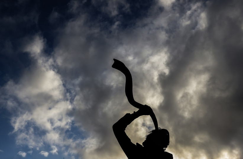  BLOWING THE shofar is an expression of faith and confidence. (photo credit: David Cohen/Flash90)