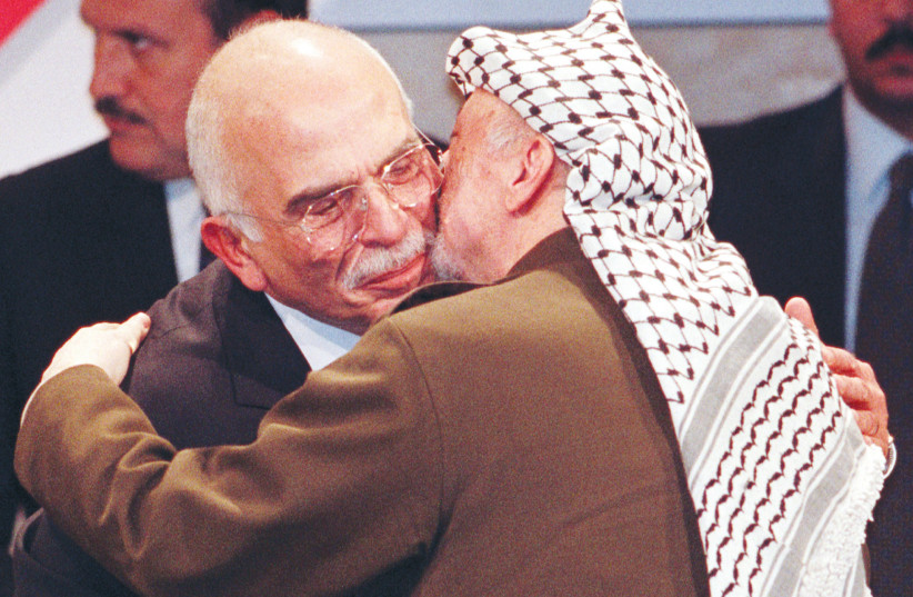  THEN-PA HEAD Yasser Arafat hugs Jordan’s King Hussein after the latter received the German Media Award, in Baden-Baden, 1997. In September 1970, the two leaders were bitter enemies.  (photo credit: REUTERS)