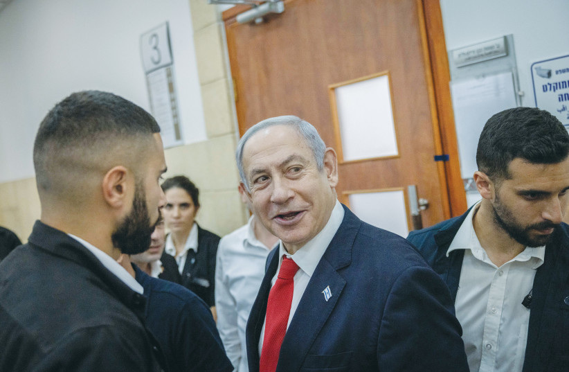  PRIME MINISTER Benjamin Netanyahu at the Jerusalem District Court, in July: Will a plea bargain be reached with him? (photo credit: Chaim Goldberg/Flash90)
