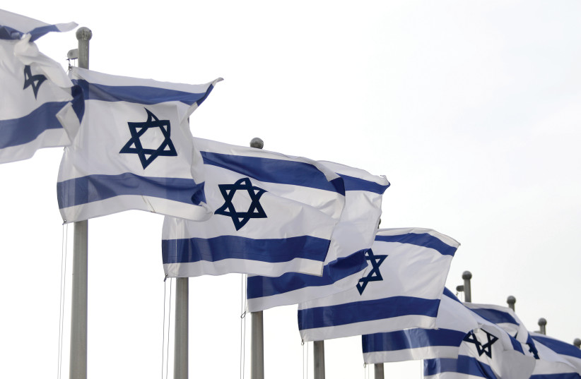  Israeli flags fluttering in the wind. (photo credit: MARC ISRAEL SELLEM/THE JERUSALEM POST)