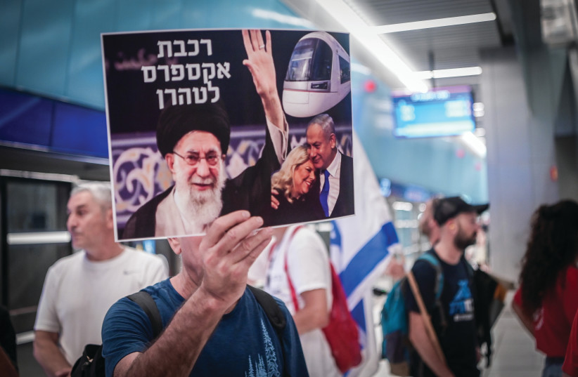  DEMONSTRATORS AT Tel Aviv’s Carlebach Station protest against the decision to not operate the new light rail on Shabbat. The placard reads: ‘Express train to Tehran.’ (photo credit: AVSHALOM SASSONI/FLASH90)