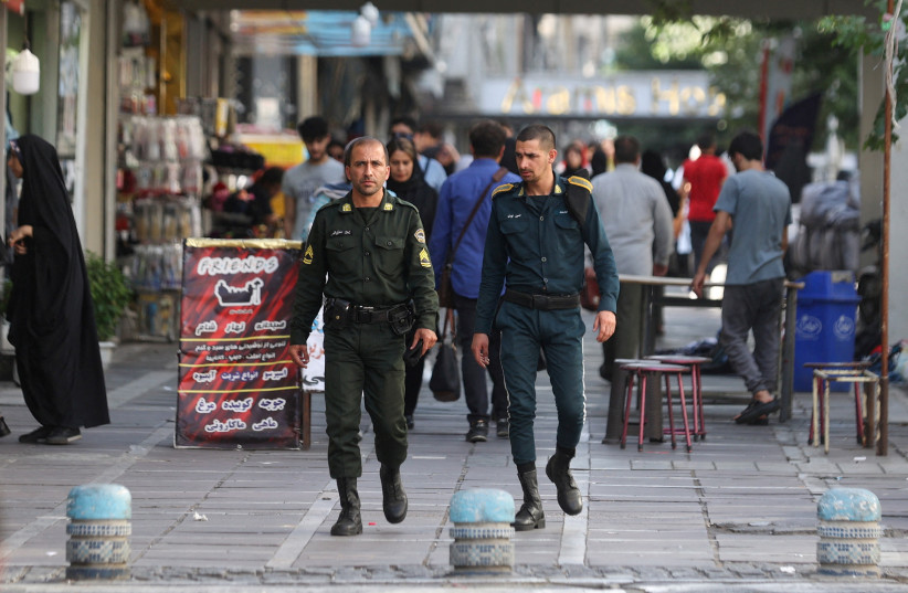  Iran's police forces walk on a street during the revival of morality police in Tehran, Iran, July 16, 2023 (photo credit: MAJID ASGARIPOUR/WANA (WEST ASIA NEWS AGENCY) VIA REUTERS)