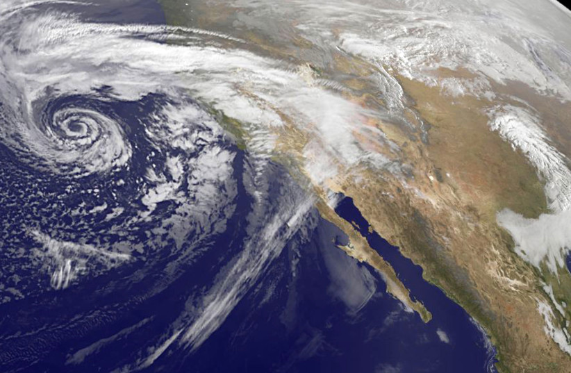 A swirling Eastern Pacific Ocean storm system headed for California is seen in an image from NOAA's GOES-West satellite taken at 0930 EST (1430 GMT) February 28, 2014. According (photo credit: REUTERS/NASA/NOAA/Handout)