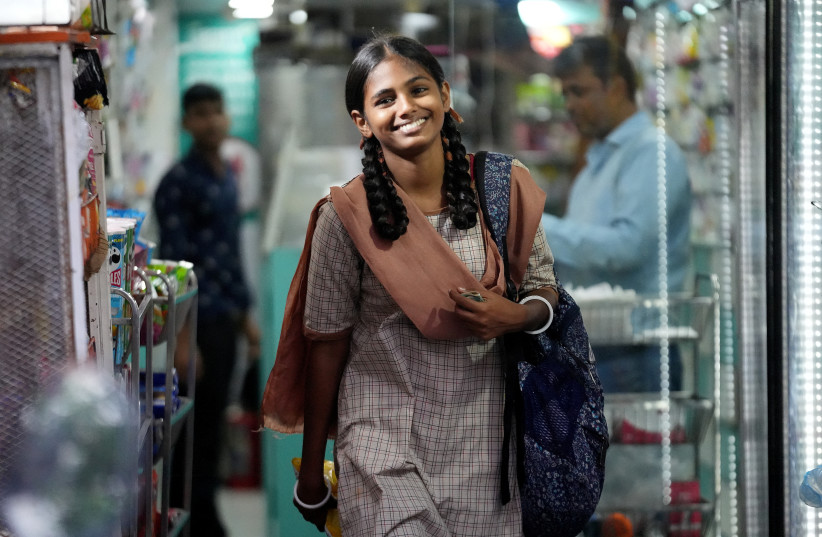 Maleesha Kharwa, 15, a model and Instagram influencer, reacts as she leaves a grocery store in Mumbai, India, September 11, 2023. (photo credit: REUTERS/HEMANSHI KAMANI)