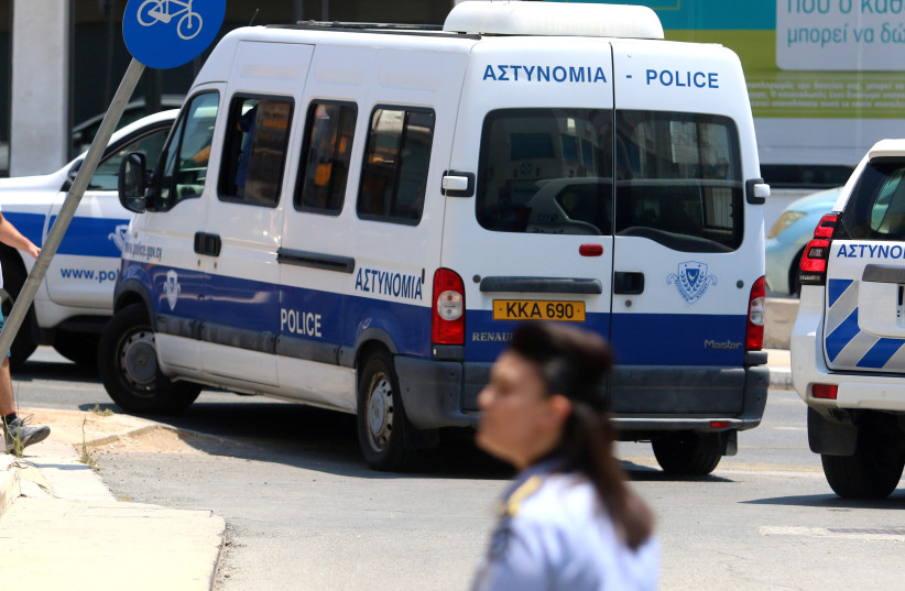  A police bus with Israeli tourists, arrested over the alleged rape of a British tourist in the resort town of Ayia Napa, leaves the Famagusta courthouse in Paralimni, Cyprus July 26, 2019 (photo credit: REUTERS/YIANNIS KOURTOGLOU)