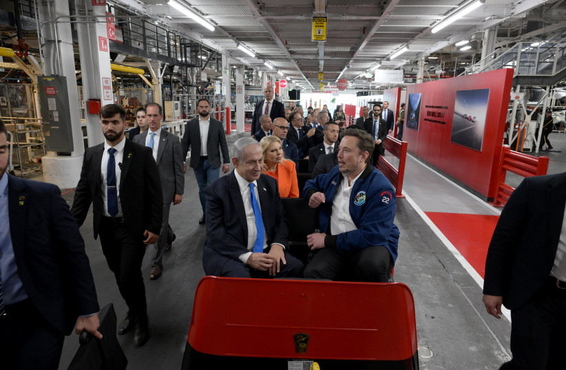  Prime Minister Netanyahu and his wife Sarah are accompanied by Elon Musk on a tour of the Tesla factory on September 18, 2023.  (photo credit: Avi Ohayon/GPO)