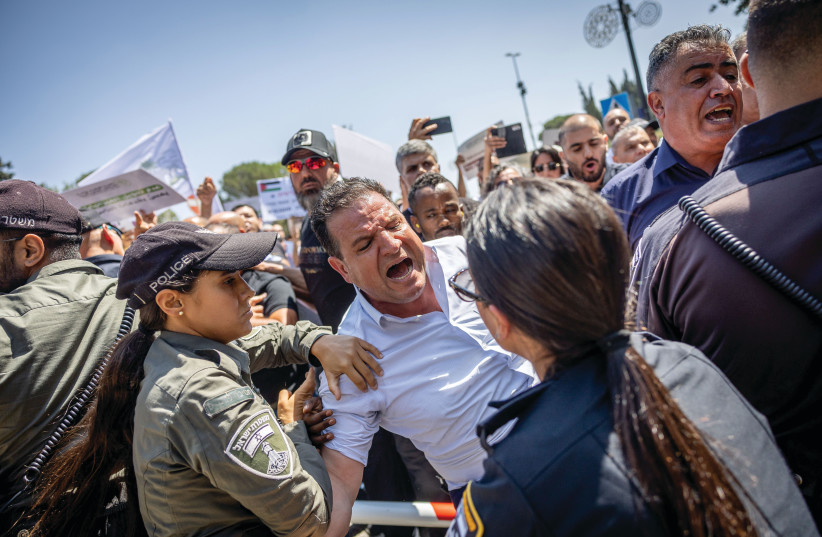  MK AYMAN ODEH is involved in a confrontation with police at a protest outside the Finance Ministry in Jerusalem in August, after Finance Minister Bezalel Smotrich initially froze funds to Arab local councils.  (photo credit: YONATAN SINDEL/FLASH90)